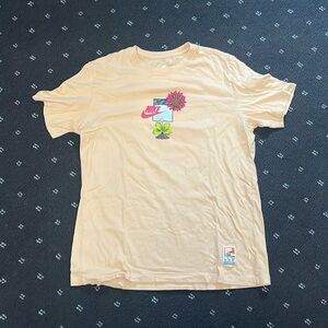 Nike light orange short sleeve tee.